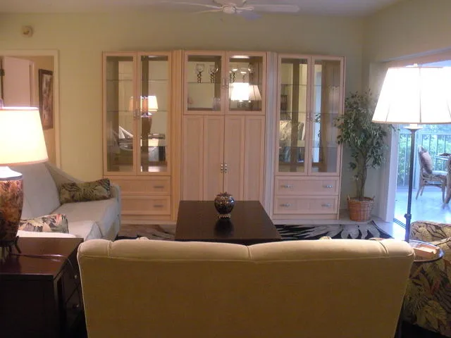 Living room with sliders opening to the lanai on the right