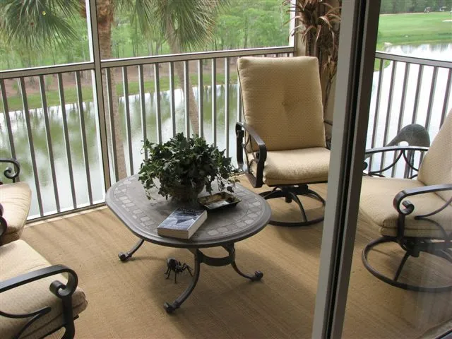 The lanai overlooks the 13th hole and a lake encircling  condos on the isle
