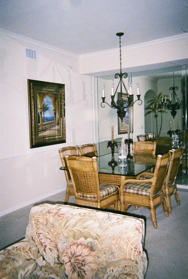 The dining room sits 6 comfortable and features a mirrored wall.