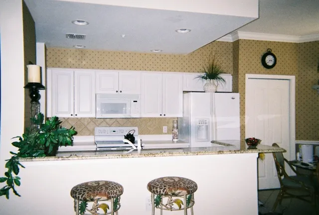 The kitchen is fully equiped and is open to the living area.
