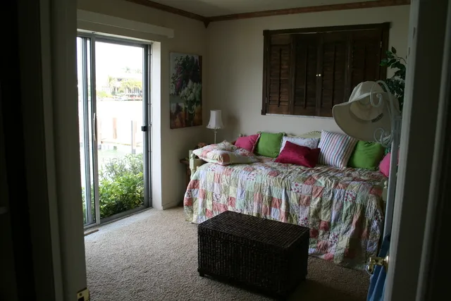 2nd bedroom with view of water. Pocketdoor to master bedroom.