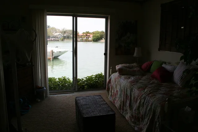 View of water from masterbedroom with open pocketdoor.