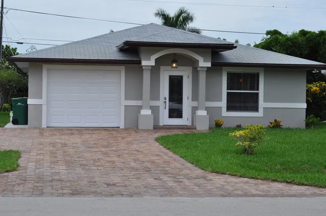 Front - Paver driveway extra parking and walk. 