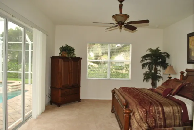 Master bedroom suite with pool view.