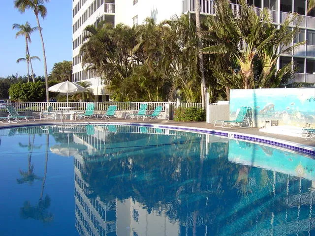 Relax by this beautiful heated pool outside your lanai.