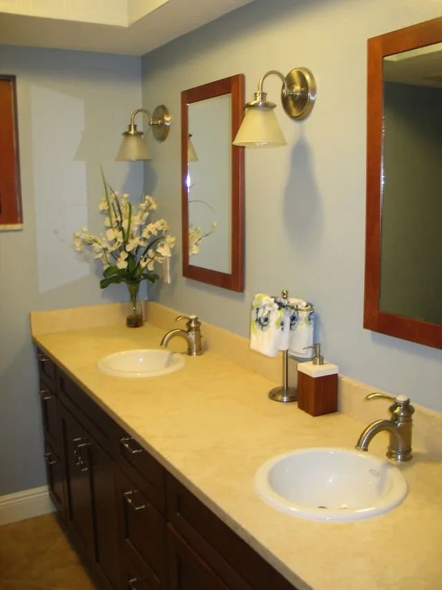 second bathroom with dual sink and full tub/shower
