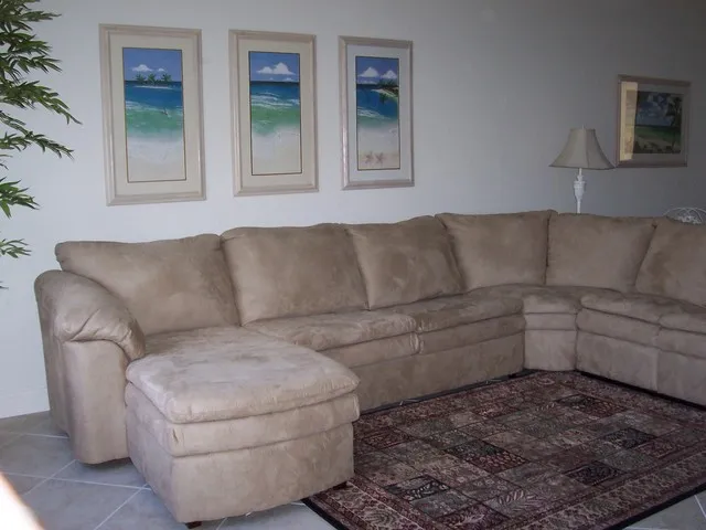 Family room w/pit-group seating includes a sofa-sleeper and lounge.