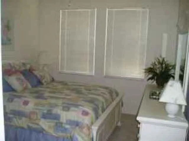 2nd Bedroom with Queen bed, double dresser & night stands.