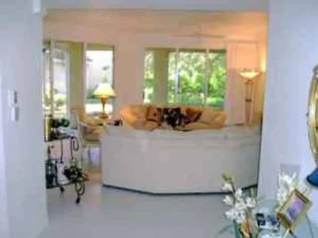 Elegant Living Room. Two couches facing each other. Sliding doors to lanai.
