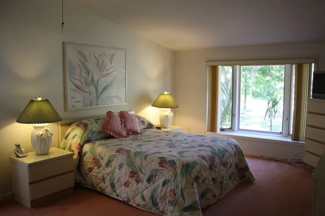MASTER BEDROOM WITH CATHEDRAL CEILINGS AT ONE END OF THE HOME FOR PRIVACY