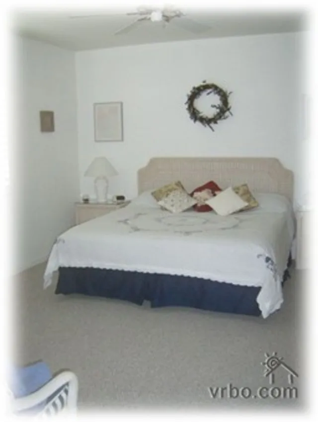 spacious master suite with sliders to lanai and elegant bathroom