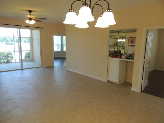 Living room & dining room w/ a bar area-master bedroom to left,den to right