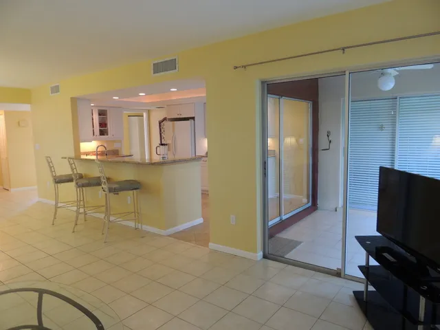 Open floor plan with sliding glass doors to the lanai area
