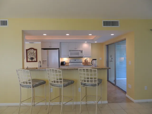 Kitchen is open to living & dining room area