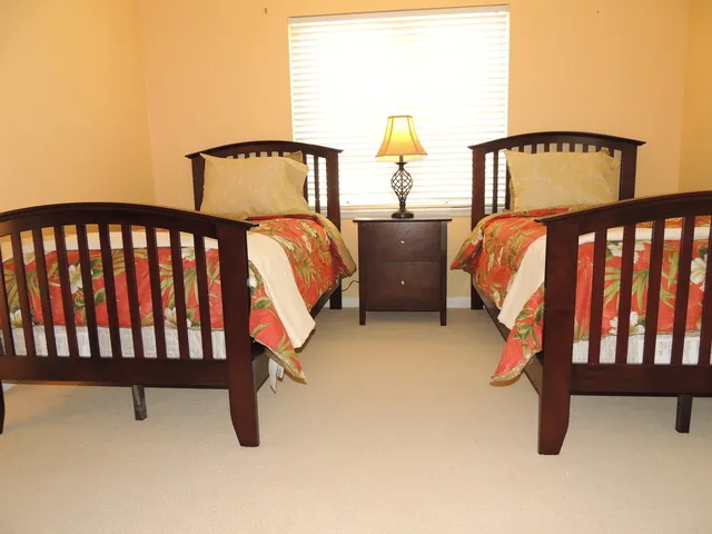 Guest room features two twin beds and a guest bath
