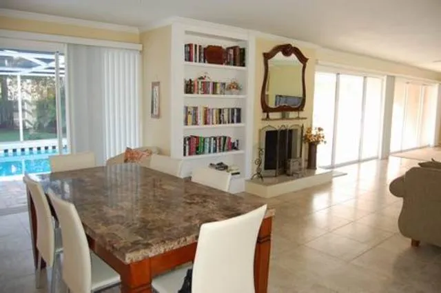 Spacious dining area and fireplace with plenty of books and games!