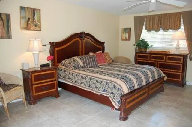 Spacious master with doors out to the pool and lanai