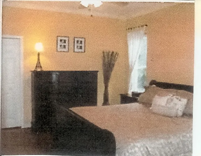 master bedroom shown with king size bed