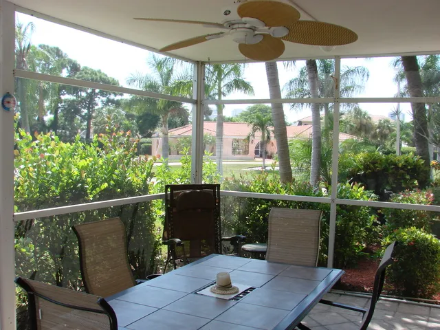 The lanai is surrounded by lush gardens and is glass enclosed!