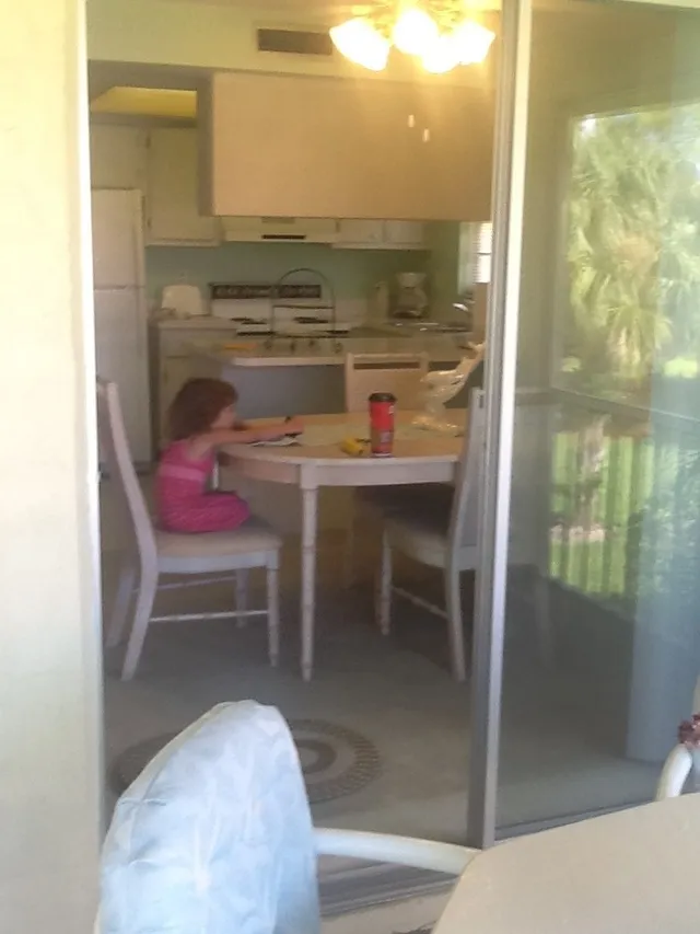 Kitchen and dining from enclosed lanai.