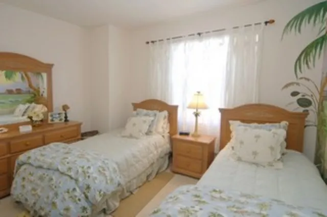 The guest room features twin beds luxury linens through out the home