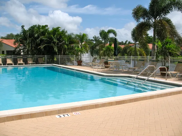 Heated swimming pool overlooking the lake and fountain
