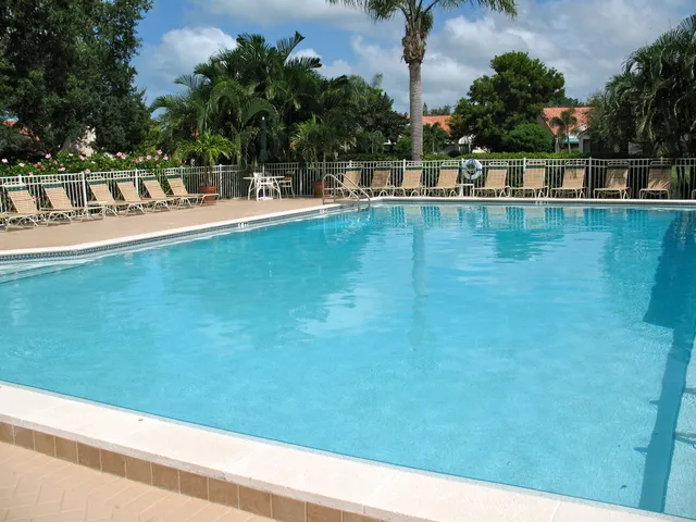 Plenty of lounge chairs for sun bathing poolside