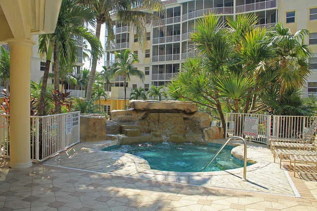 Spa - Hot Tub by Pool - Waterfall effect in background.