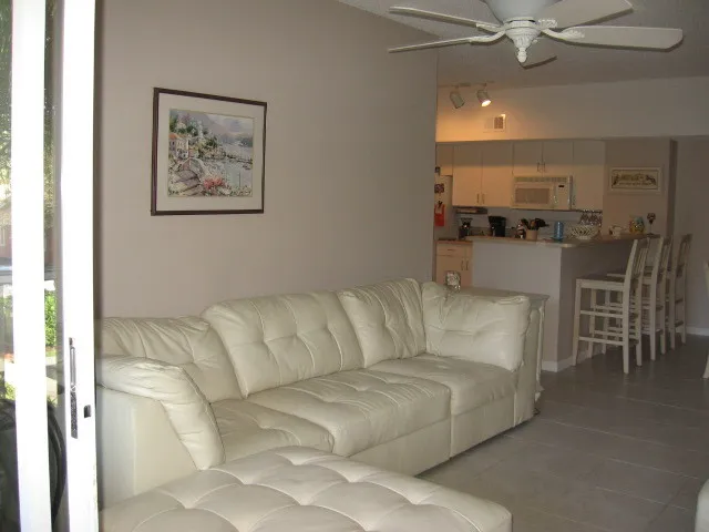 living room with off white leather sectional.  