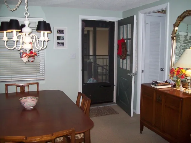 Lovely entrance into condo and formal dining area. Kitchen entrance right.
