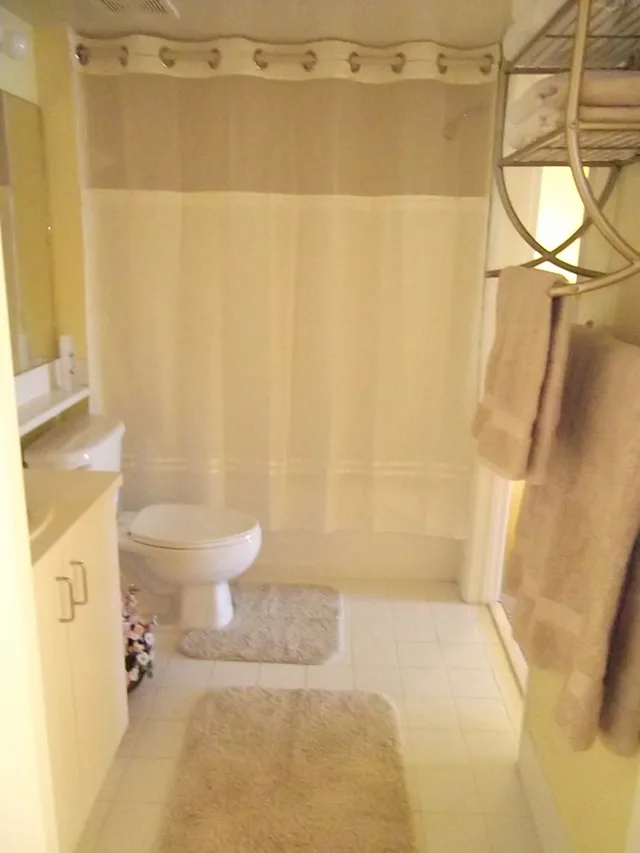 Bath has an extra vanity in the bedroom.