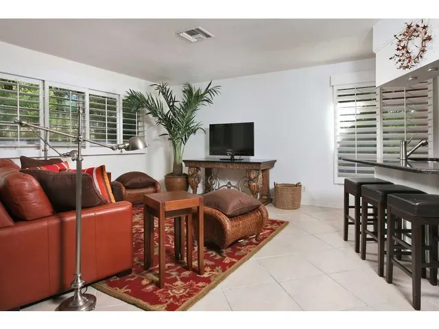 Comfy TV room open to kitchen, and living areas