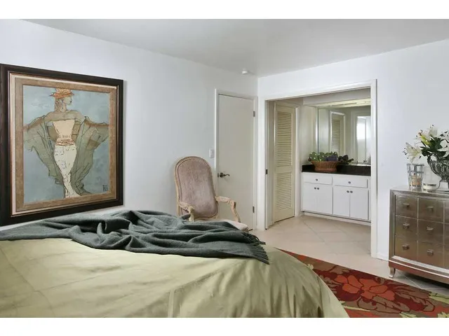 Walkin closet, adjoining bath with step in shower and outside entrance