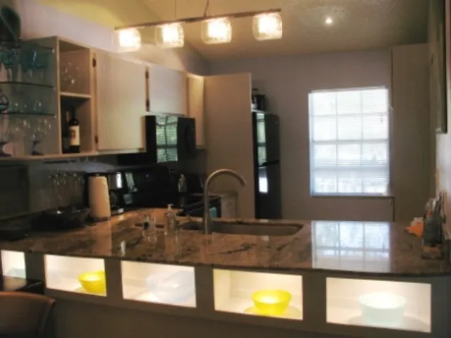 Stunning Lighted niches for evening dining. Also recessed lights throughout