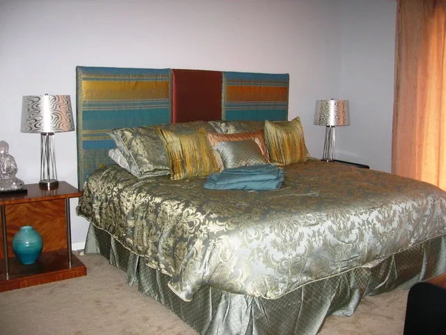 king sized bed, dresser and side tables, opens to lanai for morning sun.