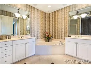 Master bath is spacious with dual sinks, walk in shower and a soaking tub