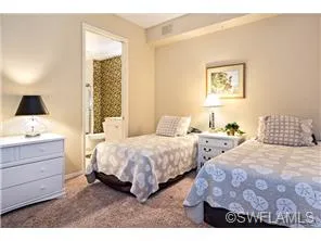 Guest suite 2 has two twin beds, walk in closet, and a private bath