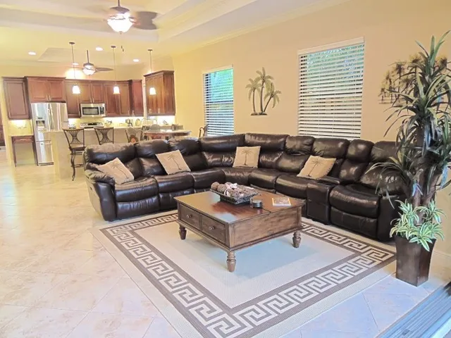 Living room features a large, leather sectional sofa - perfect for movie time!