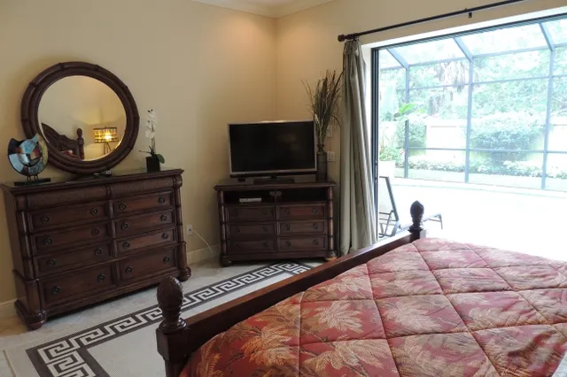 Master suite opens to the pool area and has a flat screen tv