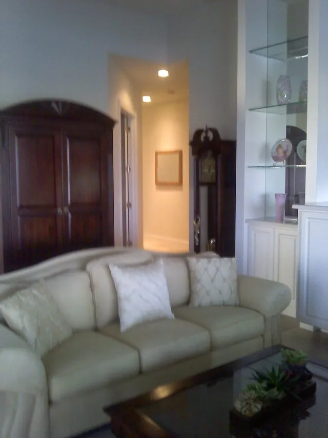 Living Area Armoire and Grandfather Clock