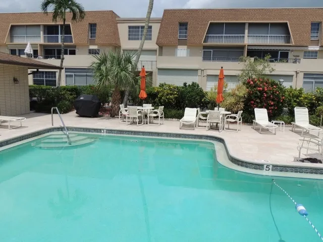 Harborside features a gorgeous pool area with a gas grill