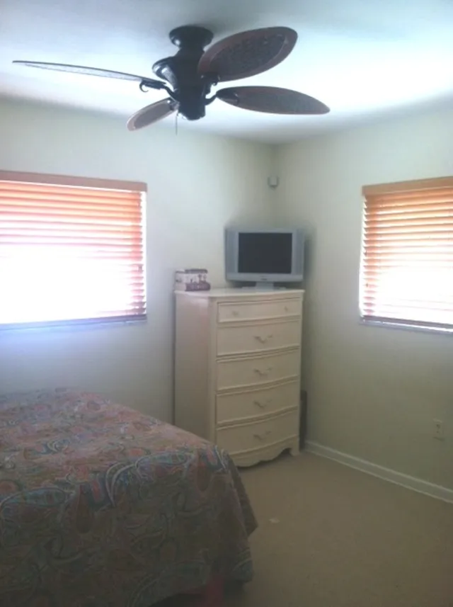 Bedroom. Large closet. Wooden window blinds. 