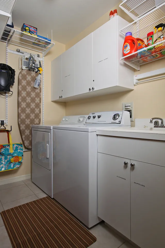 Washer and dryer in separate room in unit.