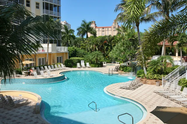 Reort pool with waterfall, spa and clubhouse.
