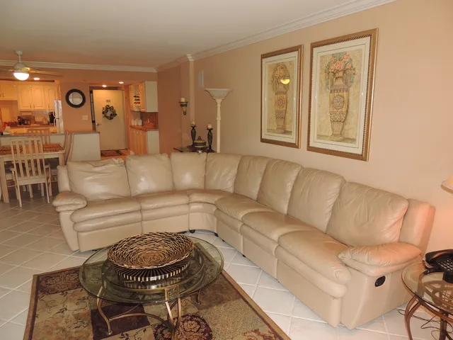 Living room features a large leather sectional 