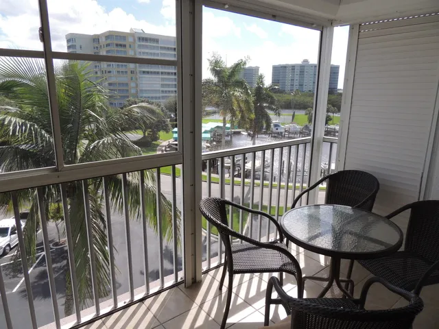 The lanai features views of the bay and marina, plus automatic shutters