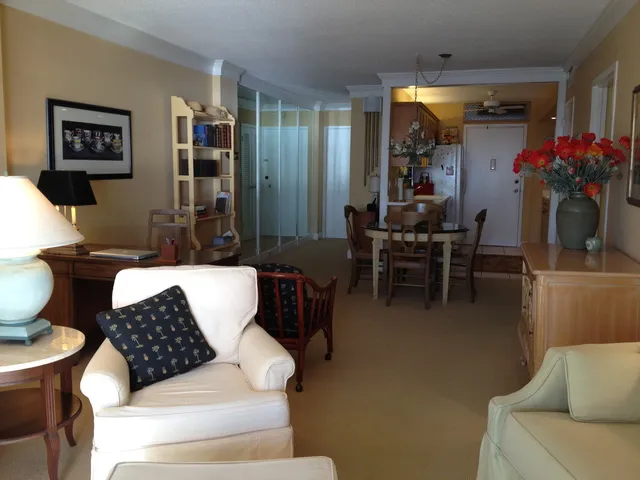 View toward front hall and kitchen from living room