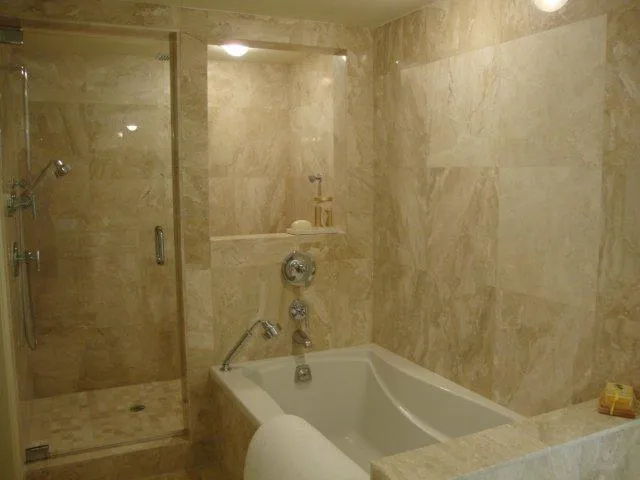 Fabulous master bath with tub, rainshower with travertine & granite.