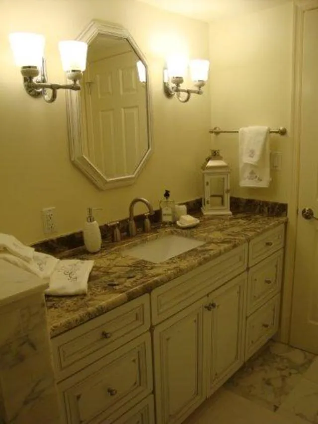 Guest bath, custom cabinets, granite & Carrera marble.