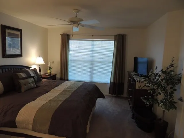 Master suite has flat screen tv and walk in closet